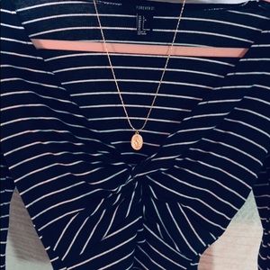 blue and white long-sleeve crop top